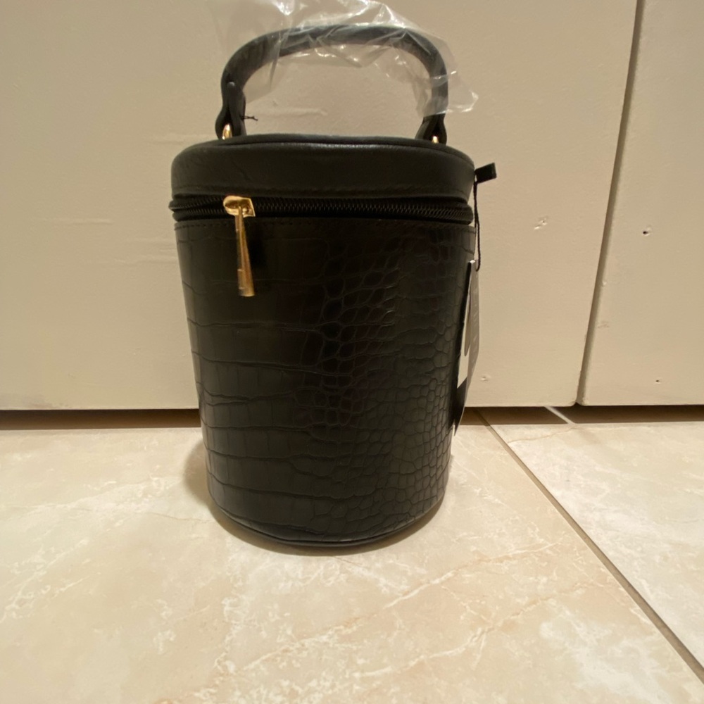 Black cylinder bag. NEW croc